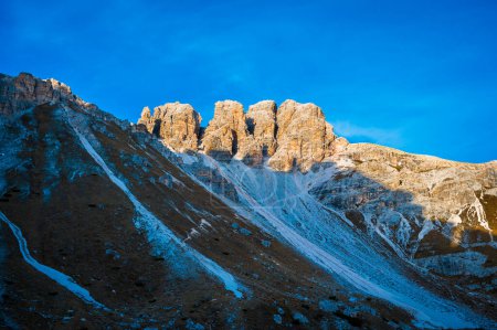 Photo for The Tre Cime di Lavaredo also called the Drei Zinnen are three distinctive battlement-like peaks, in the Sexten Dolomites of northeastern Italy. - Royalty Free Image