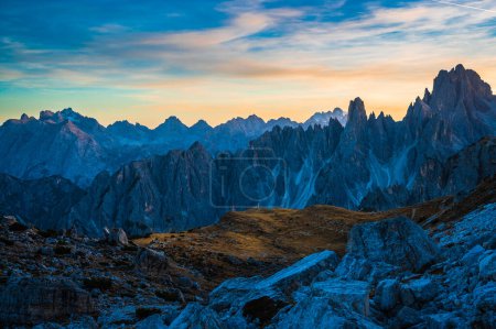 Photo for The Tre Cime di Lavaredo also called the Drei Zinnen are three distinctive battlement-like peaks, in the Sexten Dolomites of northeastern Italy. - Royalty Free Image