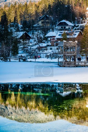 Photo for Winter reflections and fairytale houses in Kranjska Gora. Slovenia - Royalty Free Image