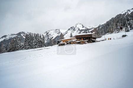 Photo for Scenic shot of beautiful snow covered wooden shacks Sauris, Province of Udine, Italy - Royalty Free Image