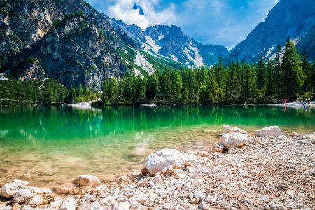 Photo for Dolomites. Braies lake and boats. Emerald colors on the water. - Royalty Free Image