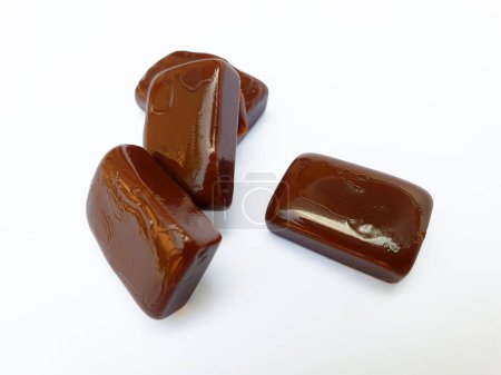 Group of Coffee caramel toffee candies isolated on white background.