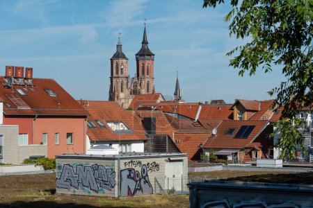 Photo for The roofs of Goettingen with the steeples of St Johannis church, Germany. More pictures from Goettingen in my collection - Royalty Free Image