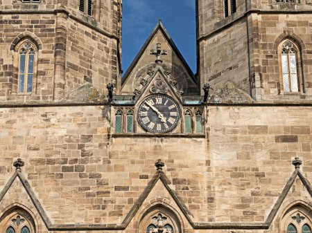 Photo for Detail of the portal with tower clock of the Basilica St. Cyriakus in Duderstadt, Germany - Royalty Free Image