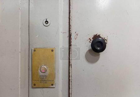 Photo for Warsaw, Masovian, Poland March 6, 2023 A fragment of the elevator door with a round handle and a call button. Old elevator Zremb - Royalty Free Image