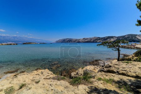 Photo for Wild empty stony beach on the Adriatic Sea Island of Rab in Croati - Royalty Free Image