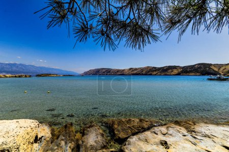 Photo for Wild empty stony beach on the Adriatic Sea Island of Rab in Croati - Royalty Free Image