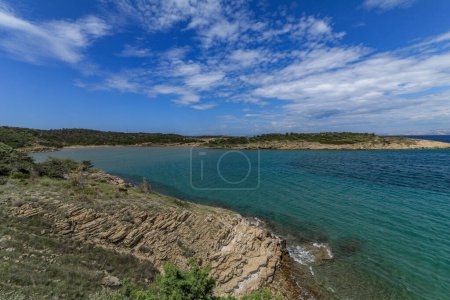 Photo for The blue Adriatic Sea, the stony shore of the island of Rab in Croatia - Royalty Free Image