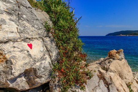 Photo for Rock of lovers beach love confession of love heart on rock in Croatia - Royalty Free Image