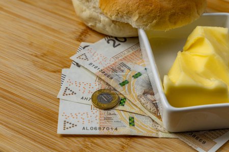 Increase in food prices in Poland, bread, butter on a cutting board, tomatoes, sausage, VAT on food Poland mone