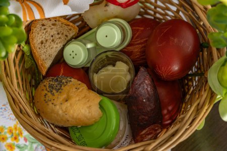 Wicker basket with food Easter decorations food in baske