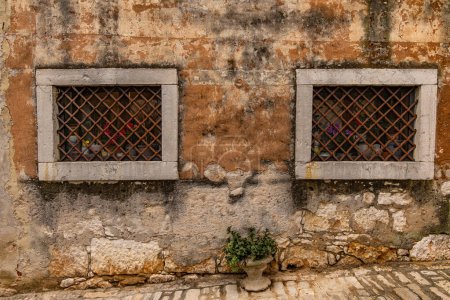 Windows in an old medieval prison buildin