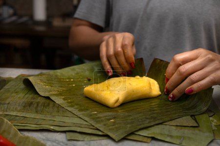 wrap a Hallaca or tamale in banana leaf.