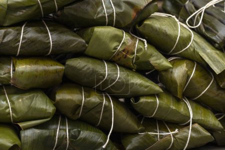 Hallaca or tamale wrapped in banana leaf. Traditional food