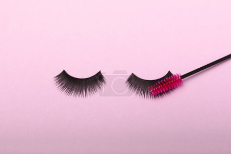 Photo for Eyelash extension brushes on a lilac background. Brush for combing extended and false eyelashes. Brush for straightening eyelashes and eyebrows. - Royalty Free Image