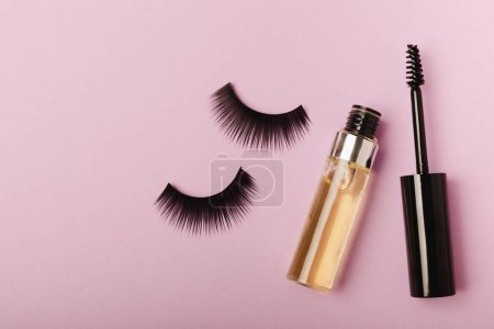 Photo for Gel for the growth of eyelashes and eyebrows. Serums, essential oils or essences for eyelash growth with a strong effect on a lilac background. Place for text. Place to copy. MOCKUP - Royalty Free Image