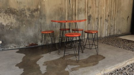 Cafe chairs are placed in the garden, comfortable for enjoying coffee and other drinks.