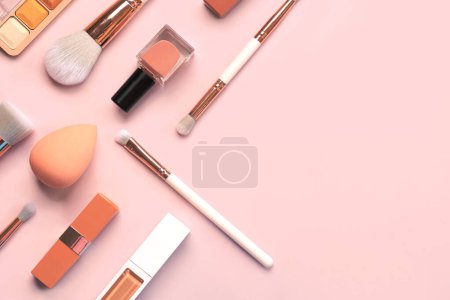 Photo for Top view of makeup brushes, eyeshadow, beauty makeup sponge,nail polish and lipstick with space for text over pink background. Beauty and makeup concept - Royalty Free Image
