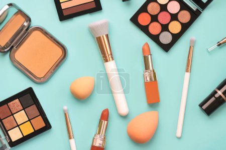 Photo for Composition with makeup brushes, beauty and makeup cosmetics and beauty makeup sponges over blue background. Beauty and makeup concept - Royalty Free Image