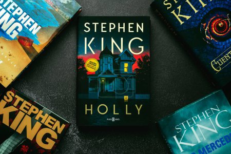 Photo for Close-up of the book in spanish Holly by American novelist Stephen King and other books by the novelist - Royalty Free Image