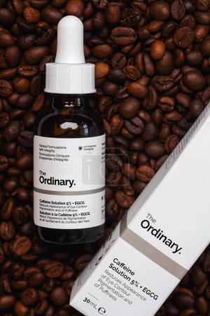 Photo for The Ordinary skincare brand. Closeup of The Ordinary caffeine solution serum and coffee beans. Illustrative editorial of The Ordinary skincare brand - Royalty Free Image