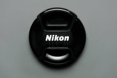 Photo for Close up of of Nikon camera lens cap on gray background. Illustrative editorial - Royalty Free Image