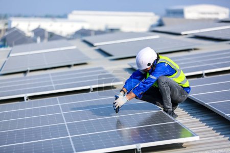 Photo for Technology solar cell, Engineer  checks installation solar cell on the roof of factory. technician checks the maintenance of the solar panels - Royalty Free Image
