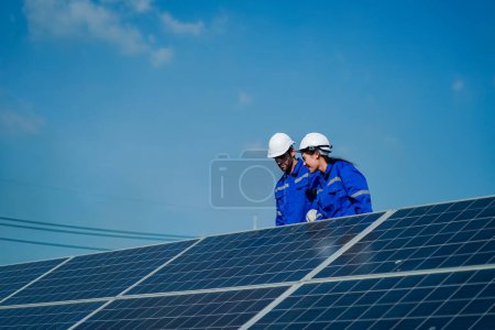 Photo for Technology solar cell, Engineer service check installation solar cell on the roof of factory. technician checks the maintenance of the solar panels - Royalty Free Image