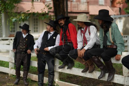 Foto de Brutal cowboys with revolver, gunfight on texas ranch, western. - Imagen libre de derechos