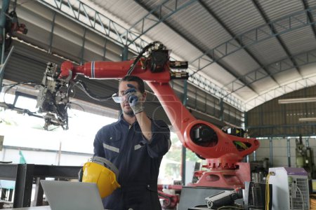 Robotic Arm engineer checking equipment of an Artificial Intelligence Computer Processor Unit