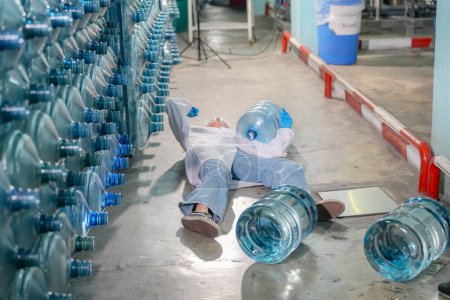 Photo for Woman get accident at Reverse osmosis system for power plant. RO system for industry, equipment which popular to install with pipe at industrial such chemical, power plant. Young happy female worker in bottling factory checking water bottles - Royalty Free Image
