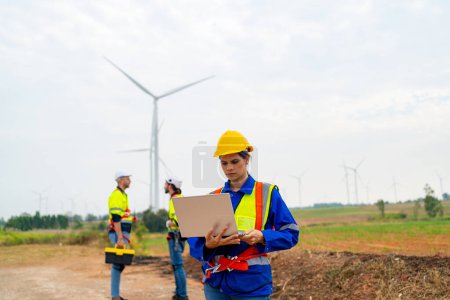 Photo for Wind turbine service engineer maintenance and plan for inspection at construction site, renewable electricity generator. - Royalty Free Image