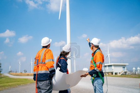 Photo for Wind turbine service engineers maintenance and plan for inspection at construction site, renewable electricity generator. - Royalty Free Image