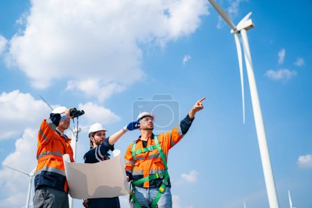 Photo for Wind turbine service engineers maintenance and plan for inspection at construction site, renewable electricity generator. - Royalty Free Image