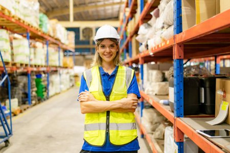 Photo for Female worker working in large warehouse. Checking parcels - Royalty Free Image