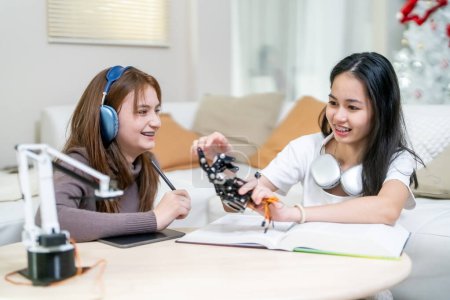 Photo for Education concept. Girls creating robot at laboratory - Royalty Free Image