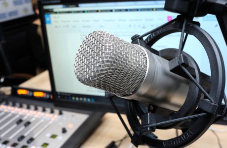 Photo for Studio microphone set during radio marathon to Radio Day at a radio studio, closeup. - Royalty Free Image
