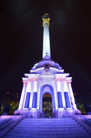 Independence Monument illuminated at night. Maidan Nezalezhnosti. Kyiv, Ukraine.