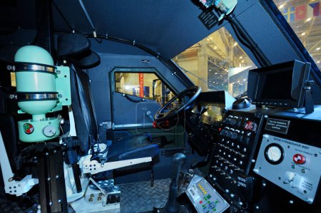 Photo for Driver-mechanic cabin of an armored personnel carrier Varta, Ukraine: seat, wheel, dashboard. Exhibition Arms and Safety-2018. October 12, 2018. Kiev Ukraine - Royalty Free Image