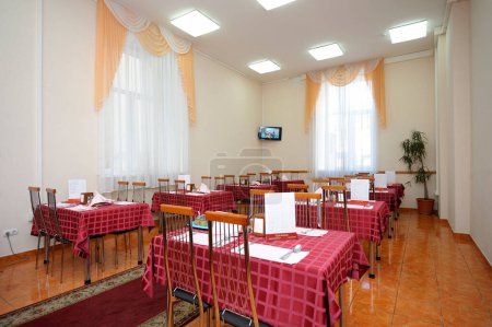 Photo for Tables set for lunch in the dining room. Day of opened door for mass-media in the Ukrainian parliament canteen. November 23. 2017. Kiev, Ukraine - Royalty Free Image