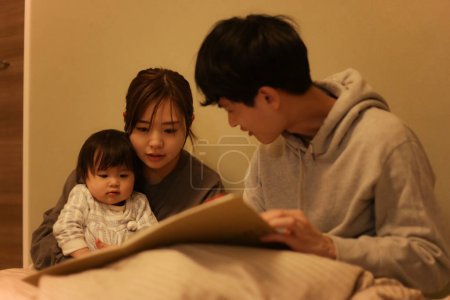 Photo for Parent and child reading a picture book - Royalty Free Image