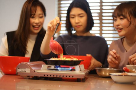 Photo for A woman making takoyaki - Royalty Free Image