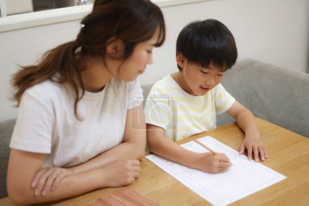 Photo for Parent and child drawing a picture diary - Royalty Free Image