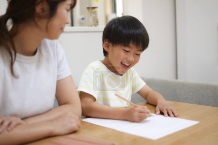 Photo for Parent and child drawing a picture diary - Royalty Free Image