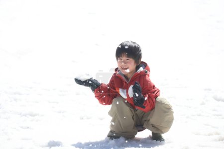 Photo for Boy playing in the snow - Royalty Free Image