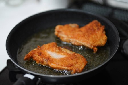 Photo for How to fry chicken thighs in oil - Royalty Free Image