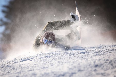 Photo for Female snowboarder falling down - Royalty Free Image