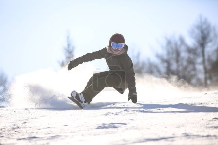 Photo for Image of a woman snowboarding - Royalty Free Image