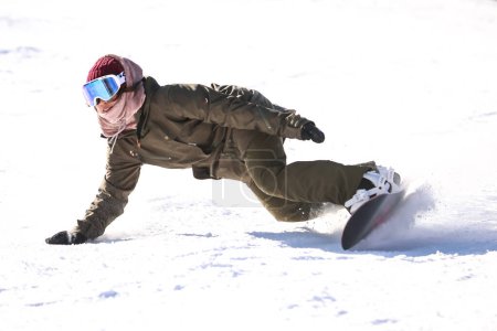 Photo for Image of a woman snowboarding - Royalty Free Image