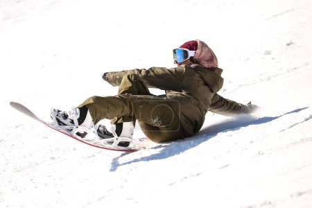 Foto de Imagen de una mujer haciendo snowboard - Imagen libre de derechos